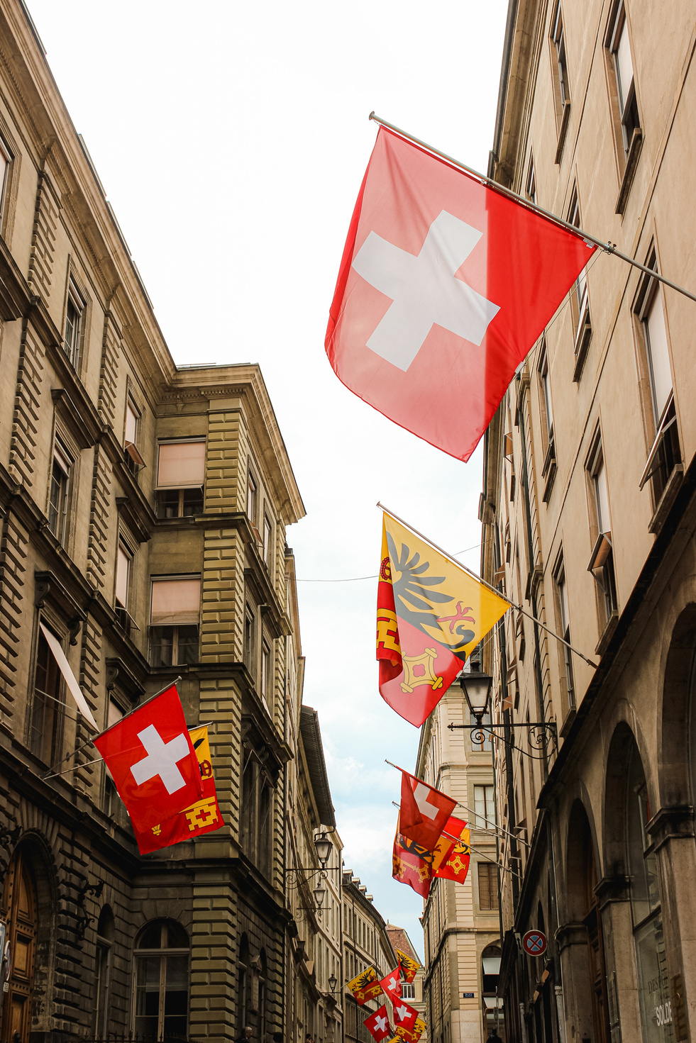 Swiss flag on buildings in narrow alley
